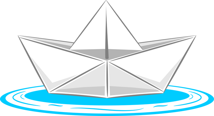 White origami paper boat floating on blue water